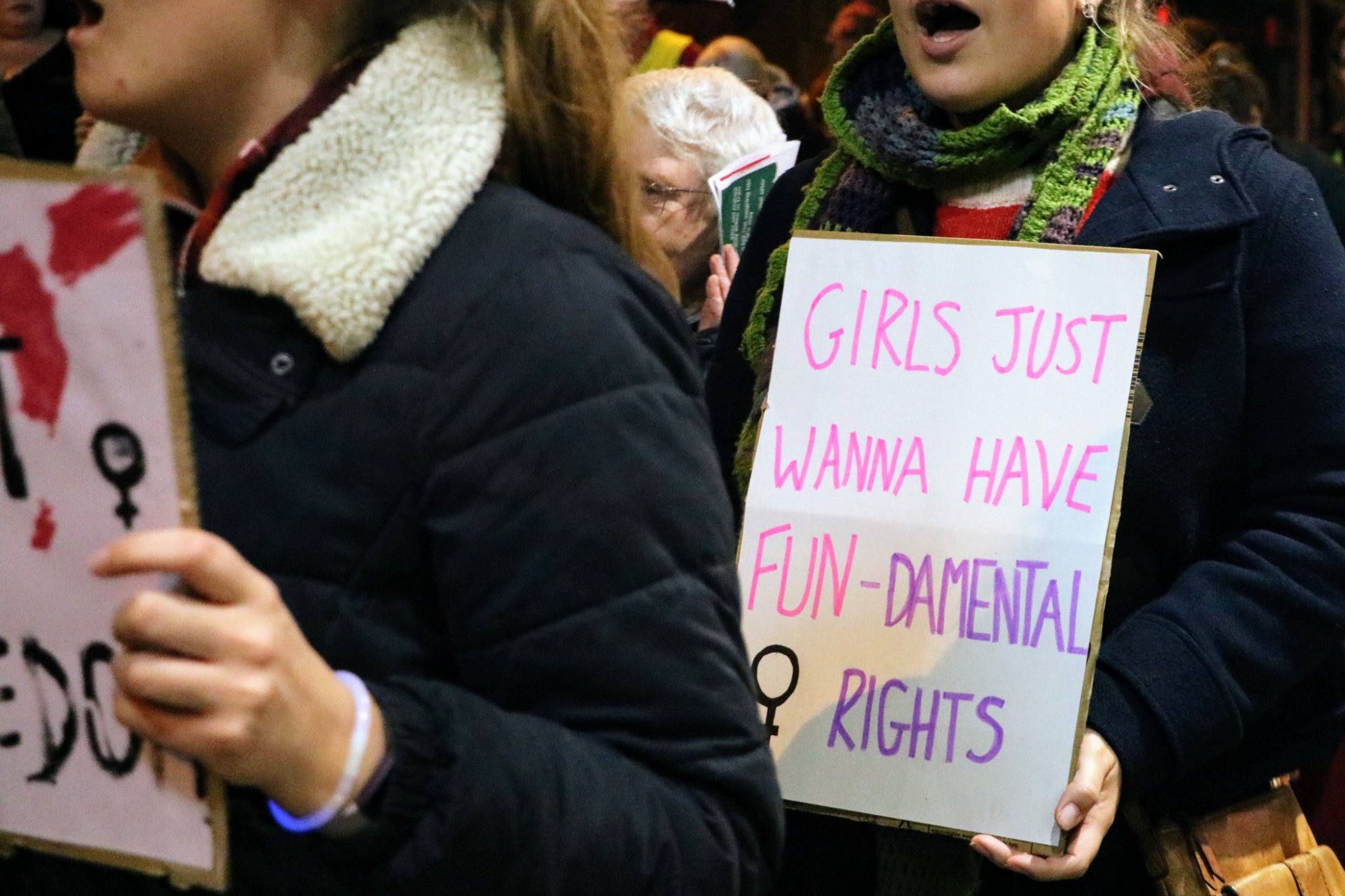People holding protest placards