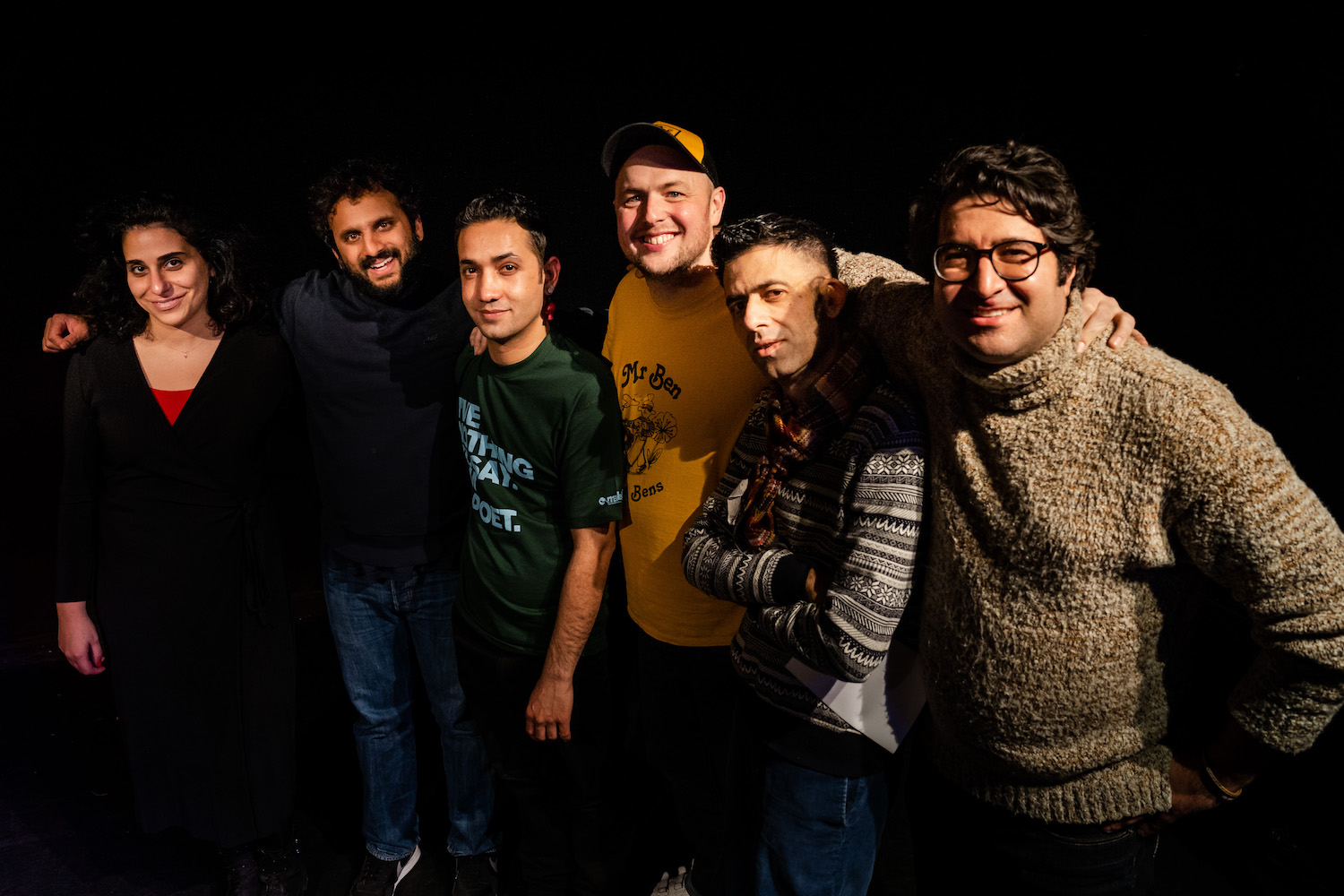 A photo of six comedians against a black background.
