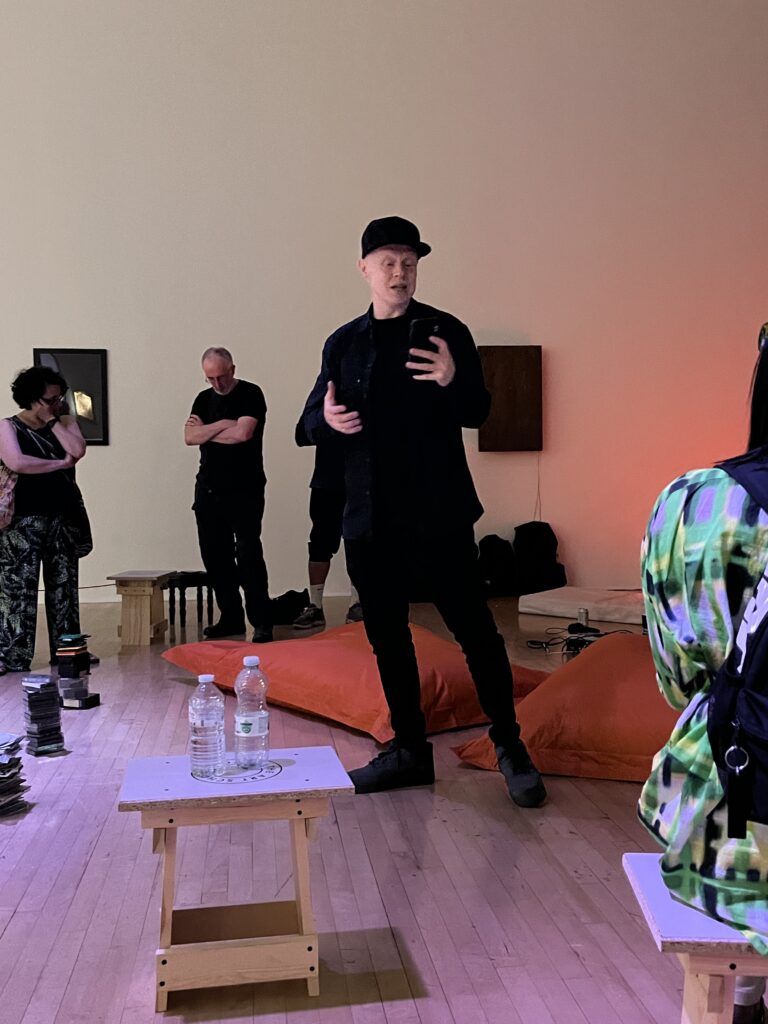 Paul Adey (Cappo) delivering a spoken word performance in the gallery