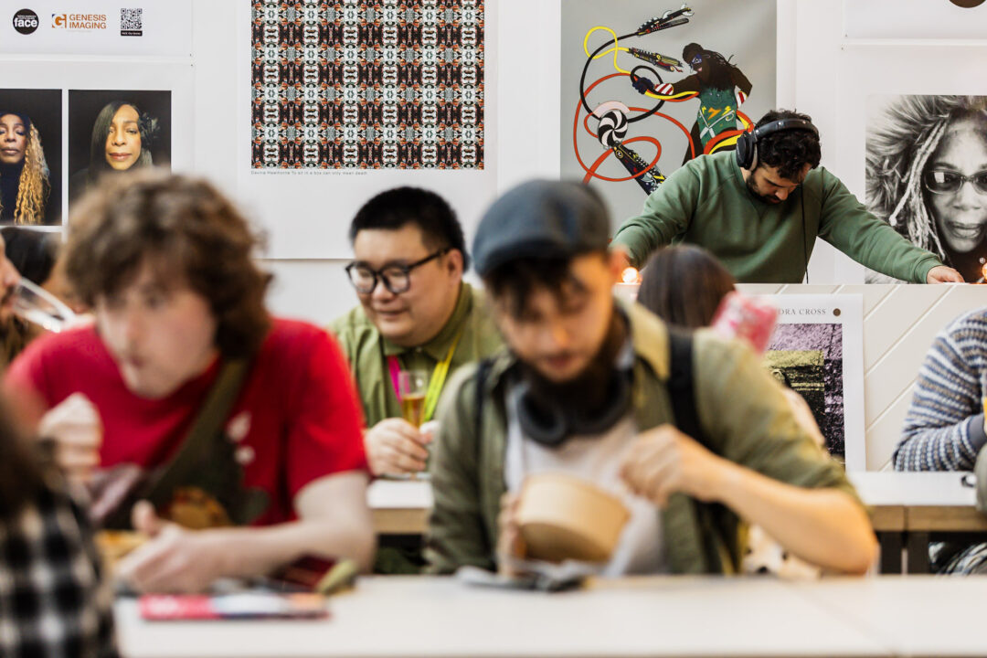 A photograph of people attending an exhibition launch