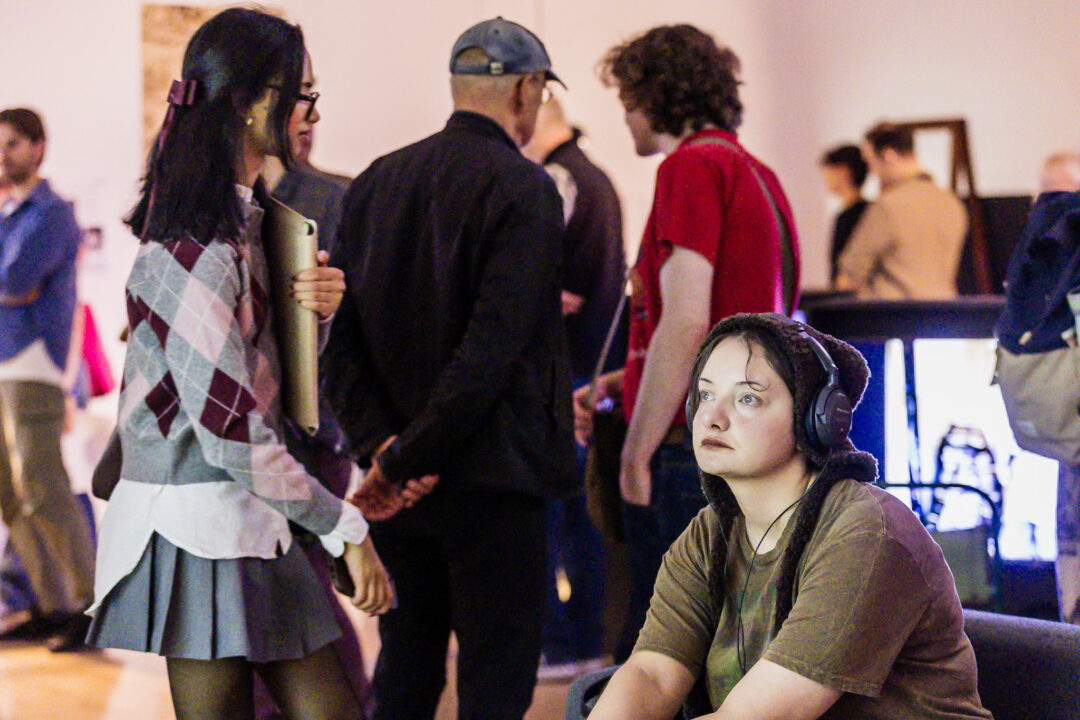 A photograph of people attending an exhibition launch