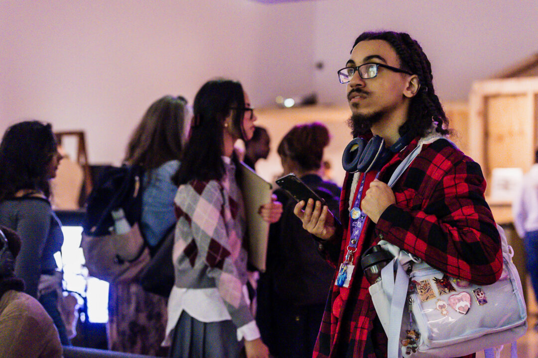 A photograph of people attending an exhibition launch