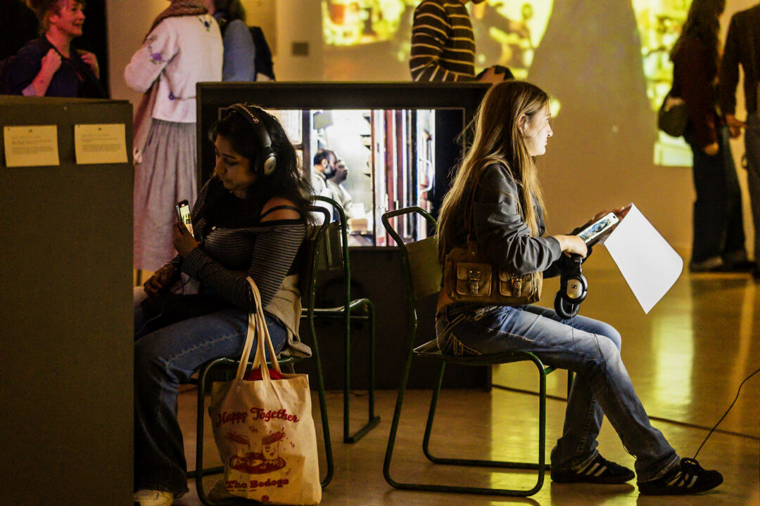 A photograph of people attending an exhibition launch