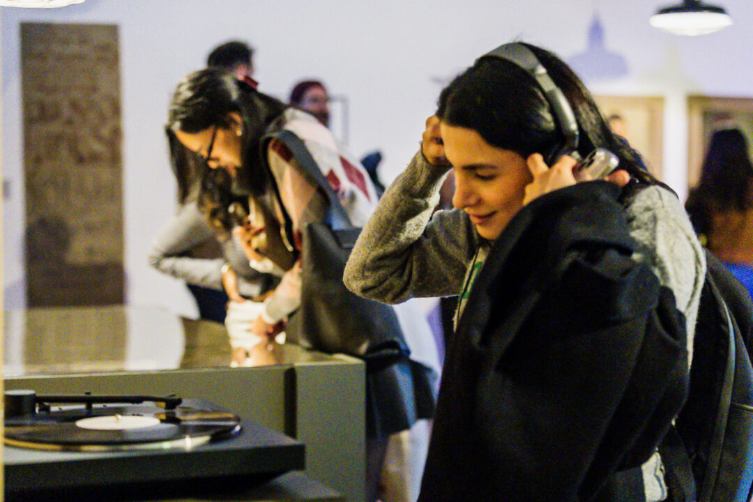A photograph of people attending an exhibition launch
