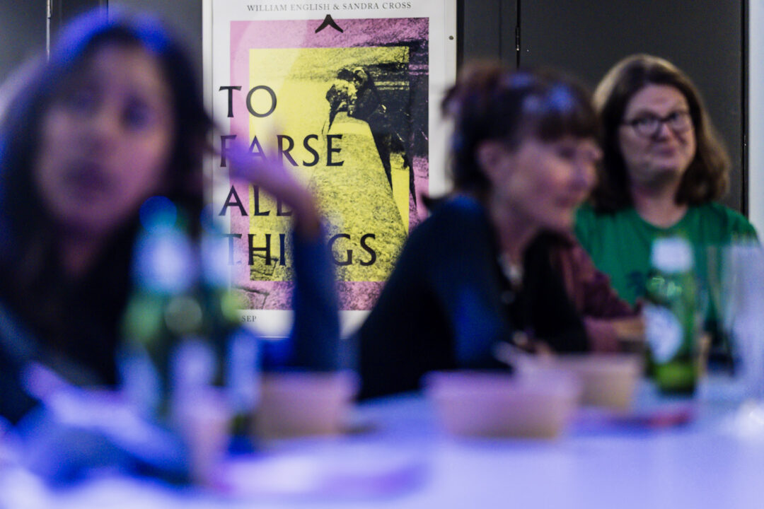 A photograph of people attending an exhibition launch