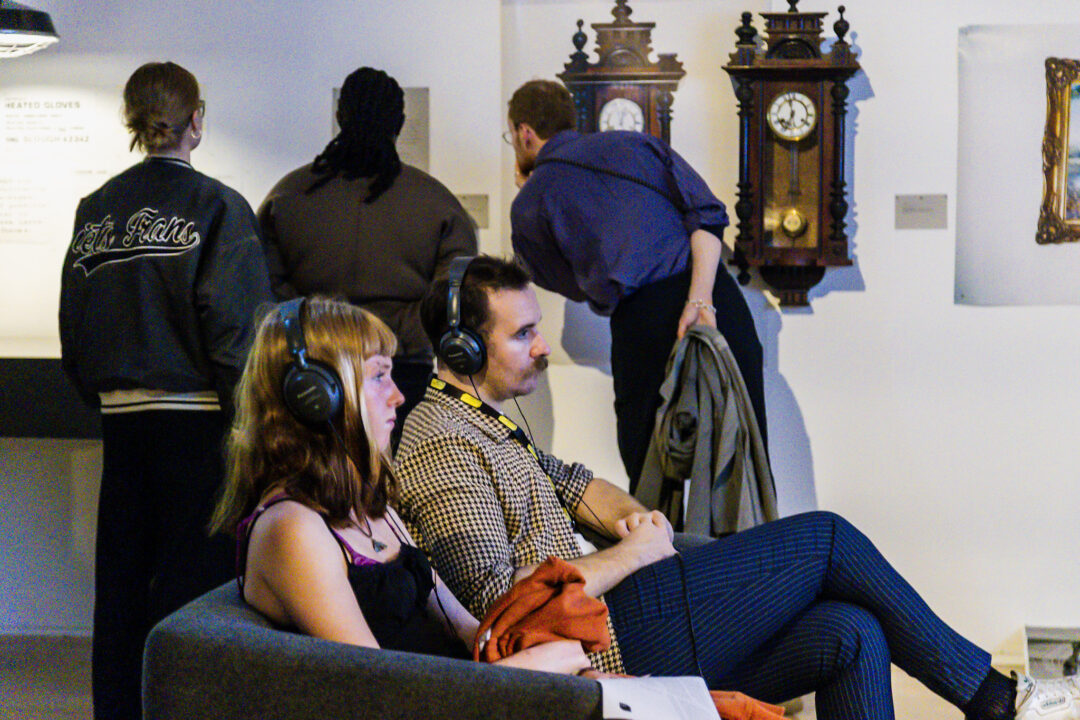 A photograph of people attending an exhibition launch