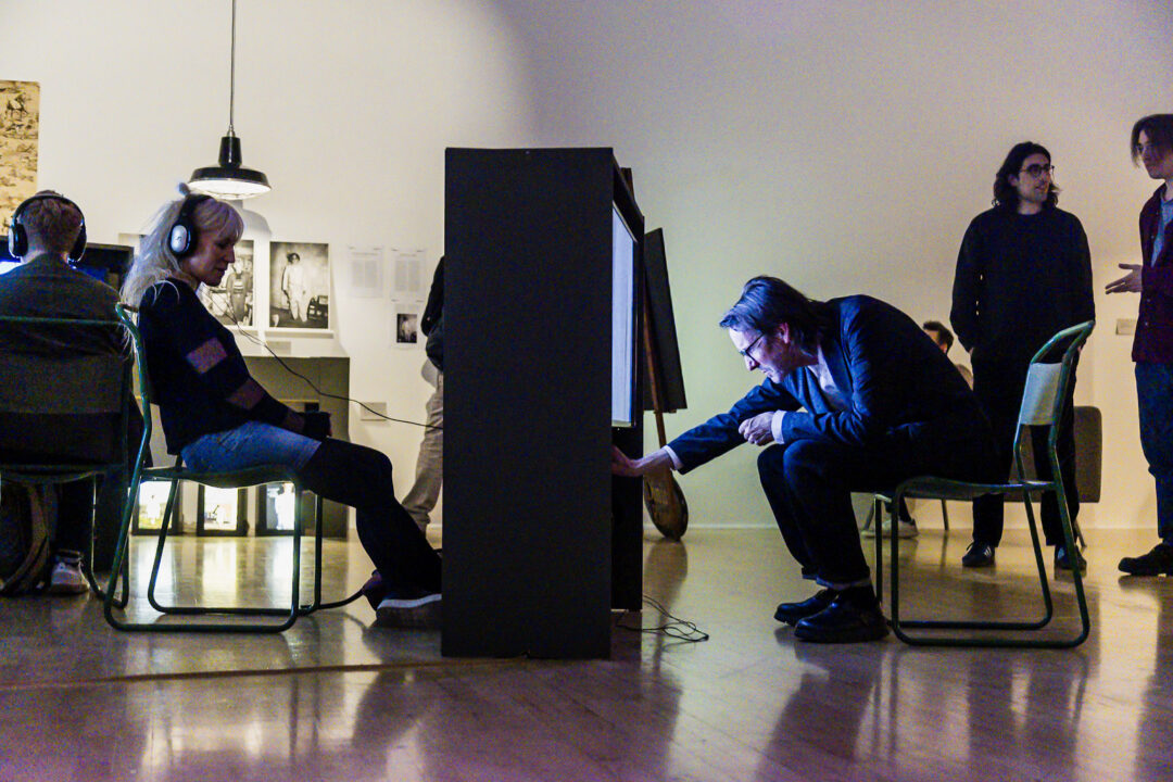 A photograph of people attending an exhibition launch