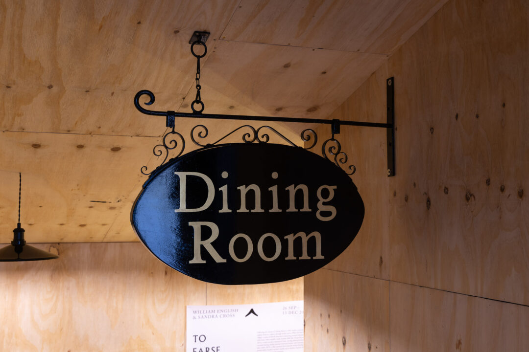 Dining Room sign hanging above entrance to exhibition