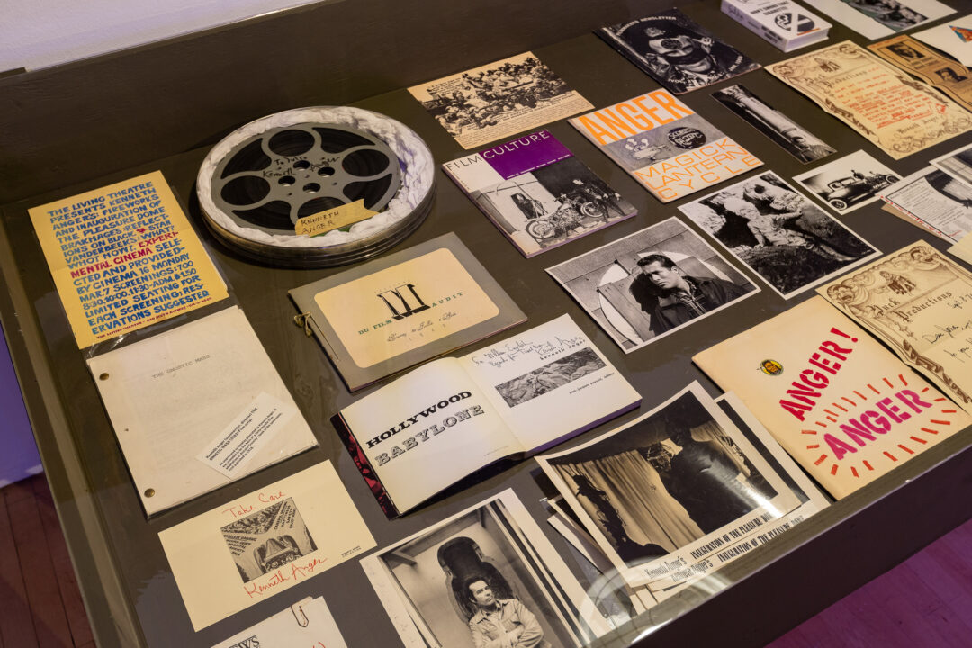 Vitrine presenting materials related to Kenneth Anger's life and work